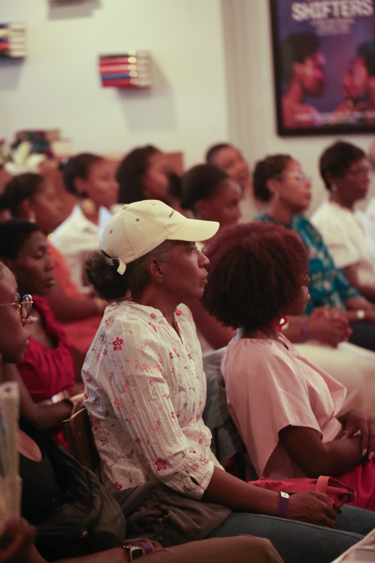 Audience members listening intently to the panel